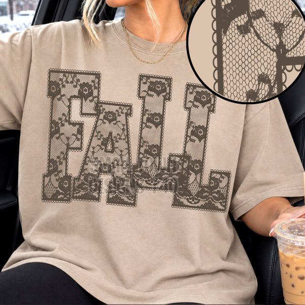 Neutral T-shirt featuring large FALL lettering with dark floral lace-style artwork
