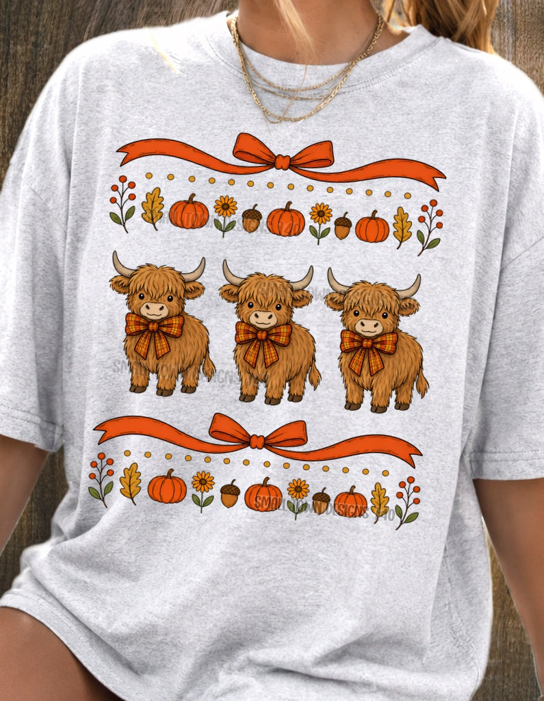 Fall Highland Cow Trio Graphic T-Shirt design shown on a model